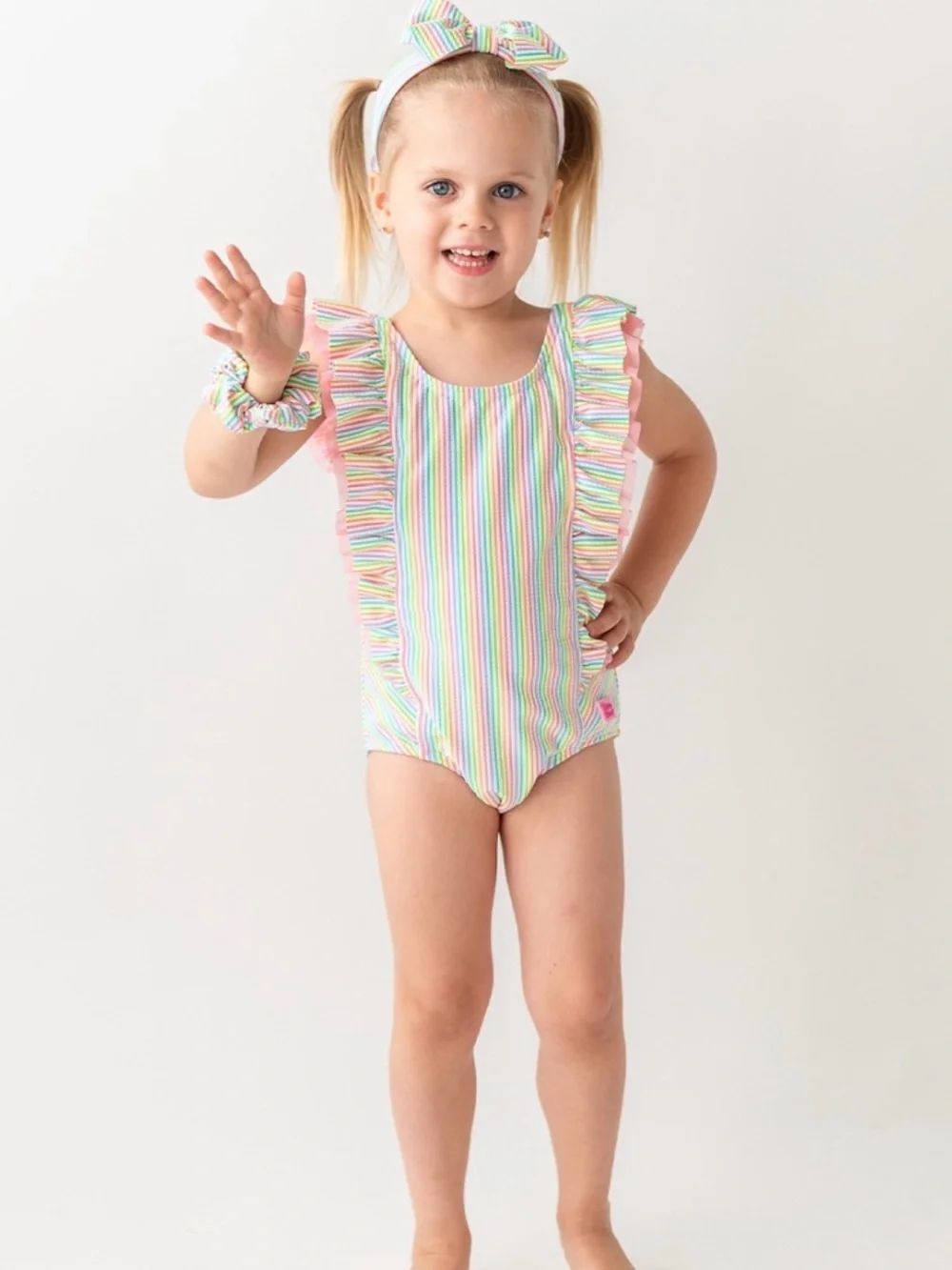 RuffleButtsโPastel Striped Rainbow Ruffle One-Piece Swimsuit Sz 7